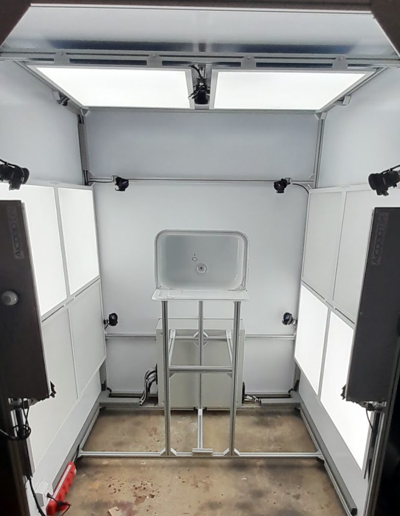 The inspection light box — controlled flat lighting around the part fixture